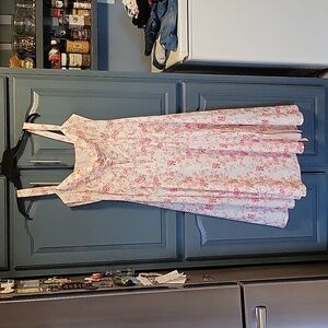 Like new summer dress with mini pink roses. Beautiful neckline. Side slit &zip
